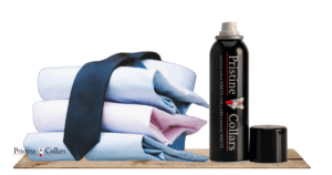 Neatly stack of dress shirts, with PristineCollars Collar Spray on a nearby shelf.